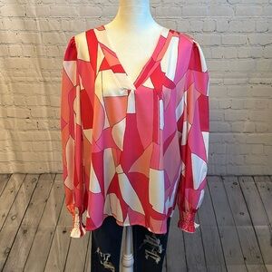 Long sleeve top with ruffled sleeves.